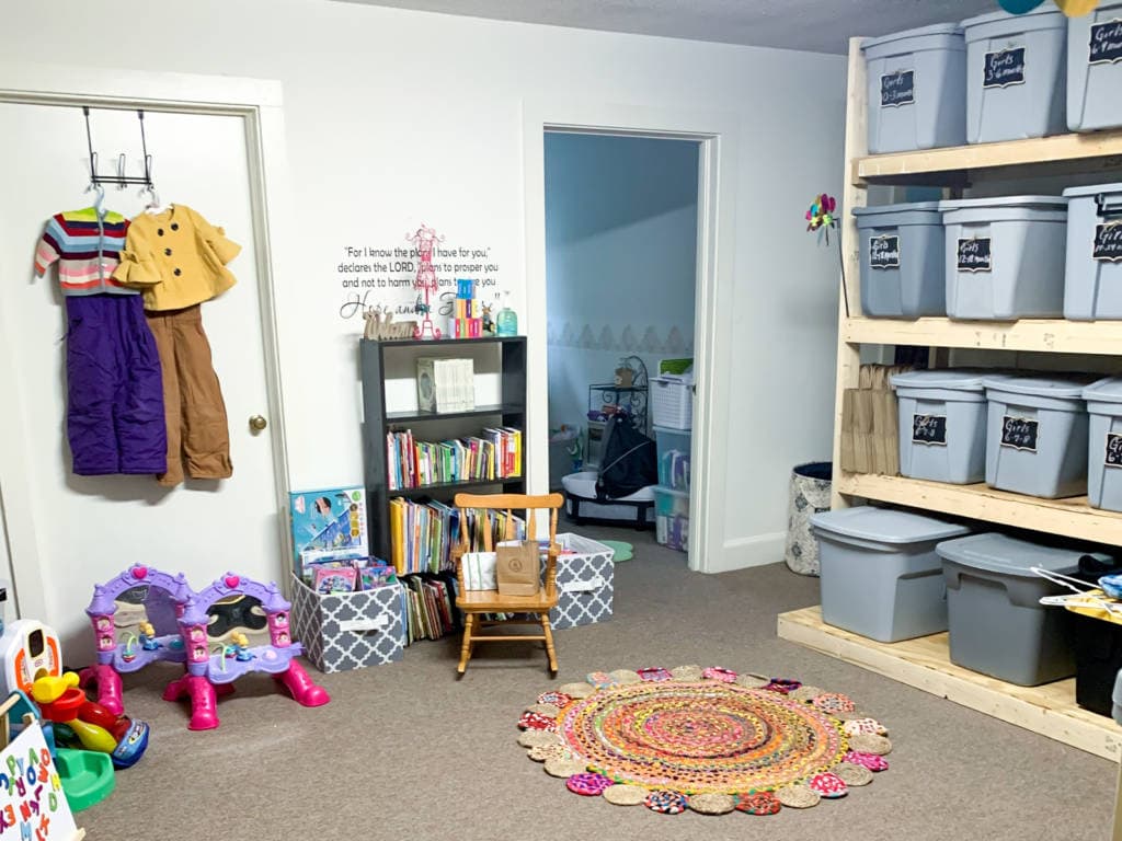 room with bins, toys, and clothes