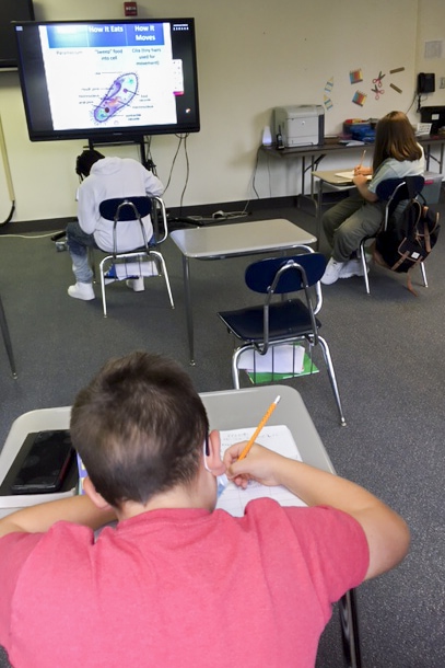 high school students working at desks