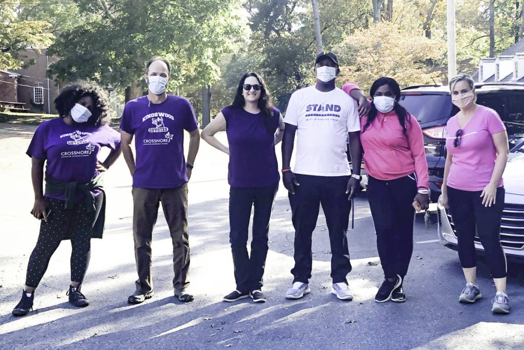 group of diverse crossnore employees taking a walk on campus