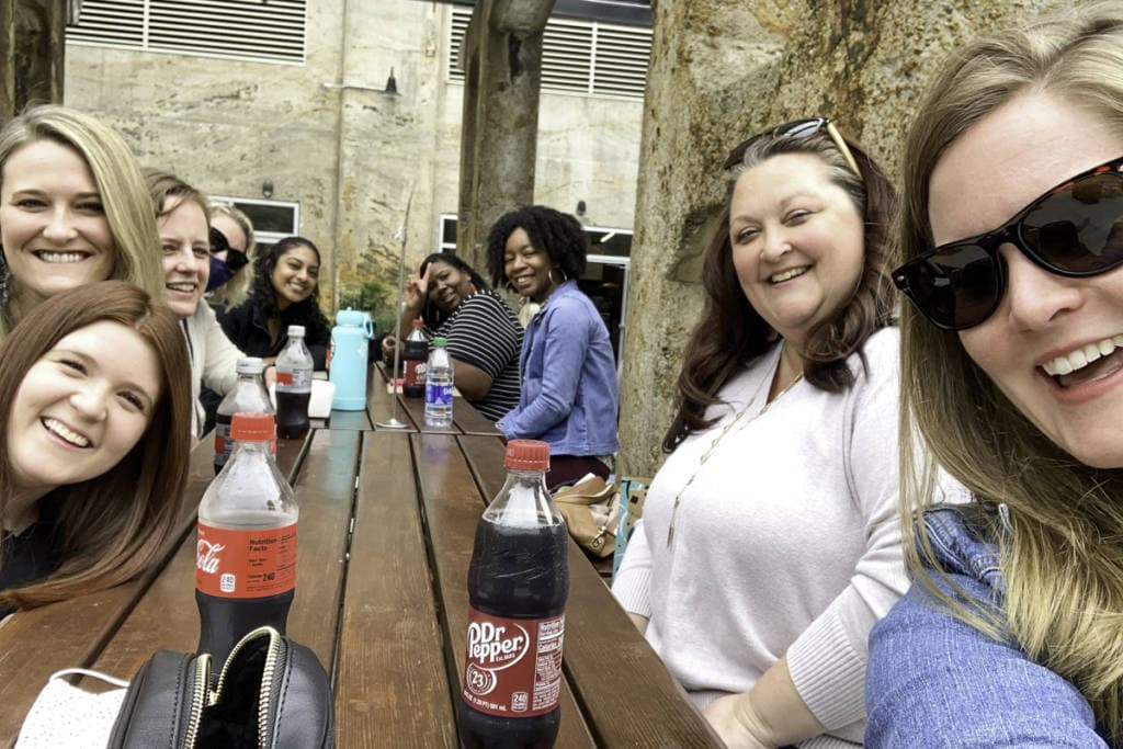 group of diverse crossnore employees eating lunch together