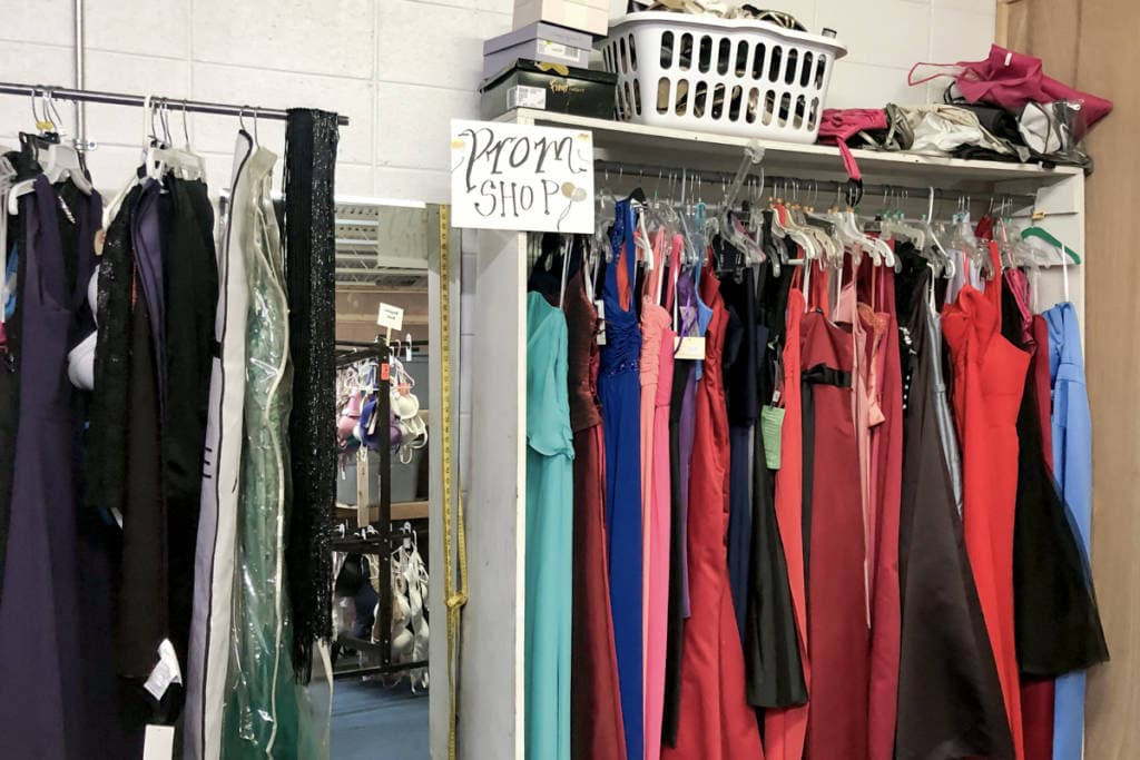 hanging racks with new with tags prom dresses