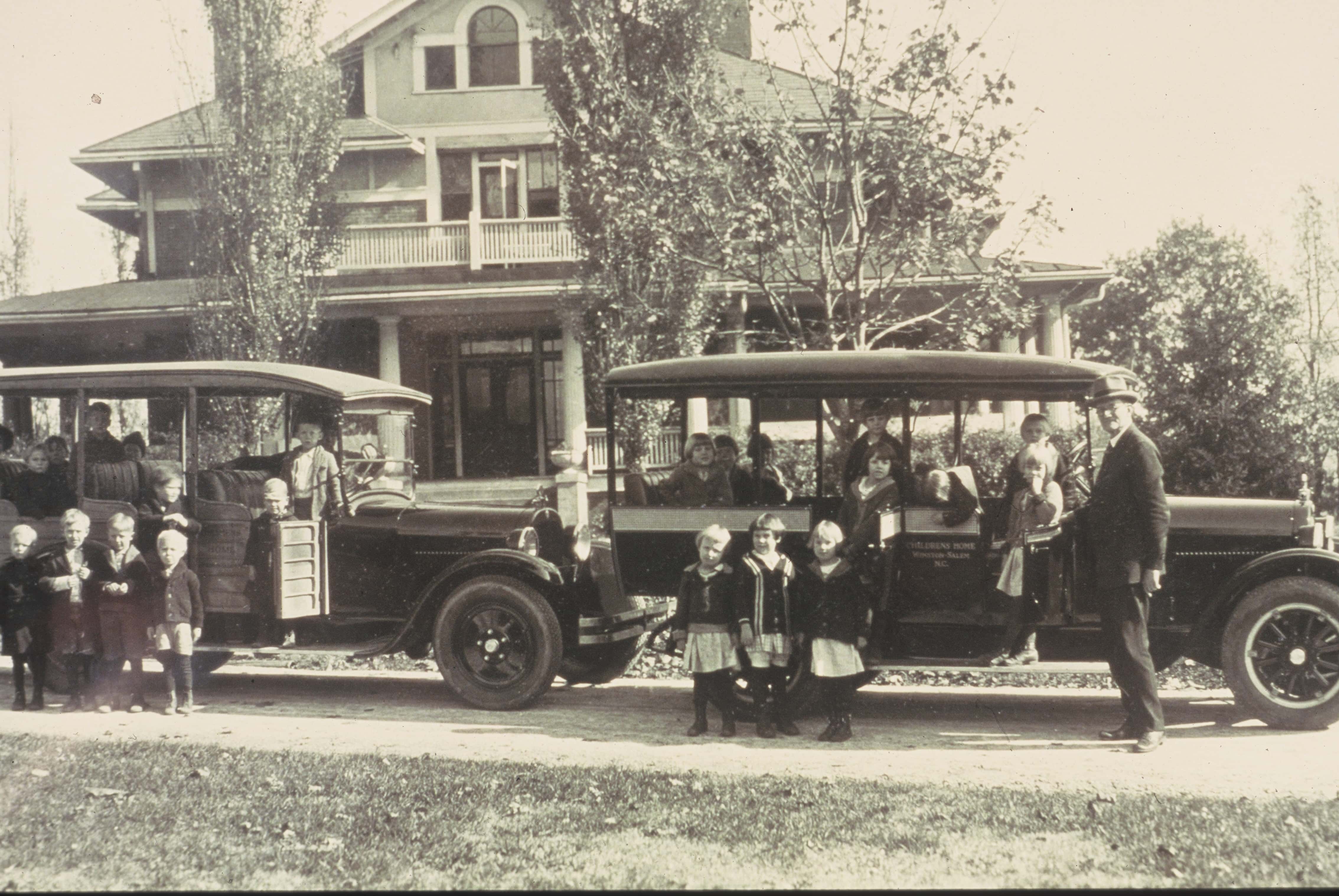 historical photo of children in 1930s cars from the children's home history