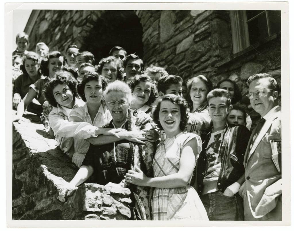 mary martin sloop with high school students in the early 60s in black and white