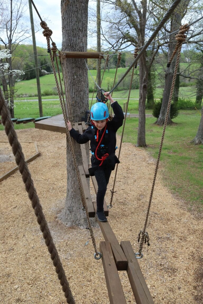Girl on high ropes course