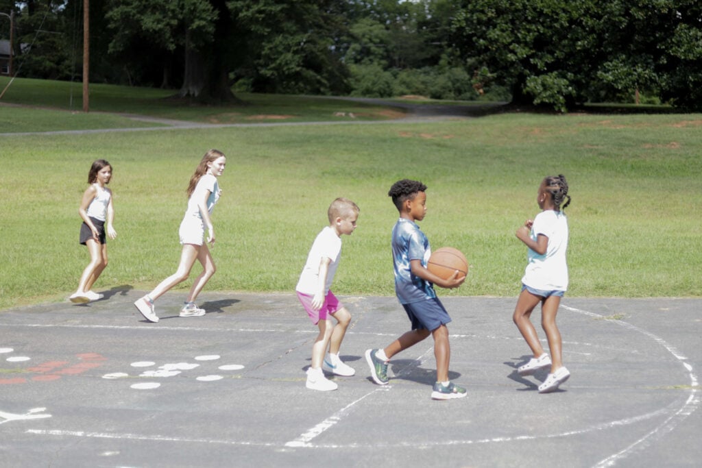 public phase campaign kids playing basketball